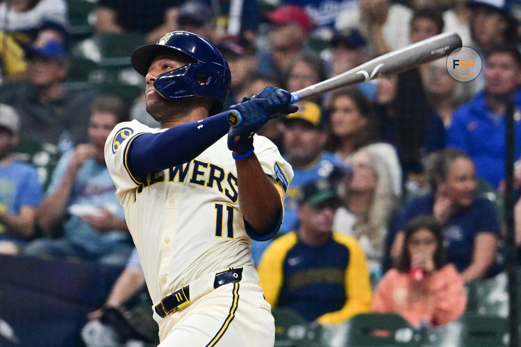 Aug 15, 2024; Milwaukee, Wisconsin, USA; Milwaukee Brewers left fielder Jackson Chourio (11) hits a two run home run against the Los Angeles Dodgers in the first inning at American Family Field. Credit: Benny Sieu-USA TODAY Sports