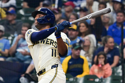 Aug 15, 2024; Milwaukee, Wisconsin, USA; Milwaukee Brewers left fielder Jackson Chourio (11) hits a two run home run against the Los Angeles Dodgers in the first inning at American Family Field. Mandatory Credit: Benny Sieu-USA TODAY Sports