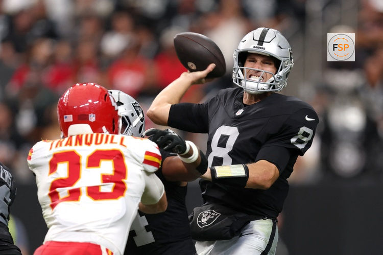 Oct 4, 2026; Paradise, Nevada, USA;  Las Vegas Raiders quarterback Kirk Cousins (8) throws a pass against Kansas City Chiefs linebacker Drue Tranquill (23) during the fourth quarter at Allegiant Stadium.  Credit: David Brytus-Imagn Images