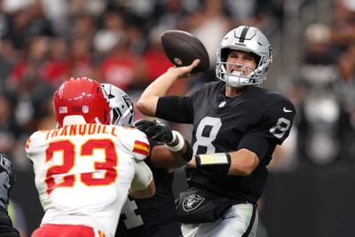 Oct 4, 2026; Paradise, Nevada, USA;  Las Vegas Raiders quarterback Kirk Cousins (8) throws a pass against Kansas City Chiefs linebacker Drue Tranquill (23) during the fourth quarter at Allegiant Stadium.  Mandatory Credit: David Brytus-Imagn Images