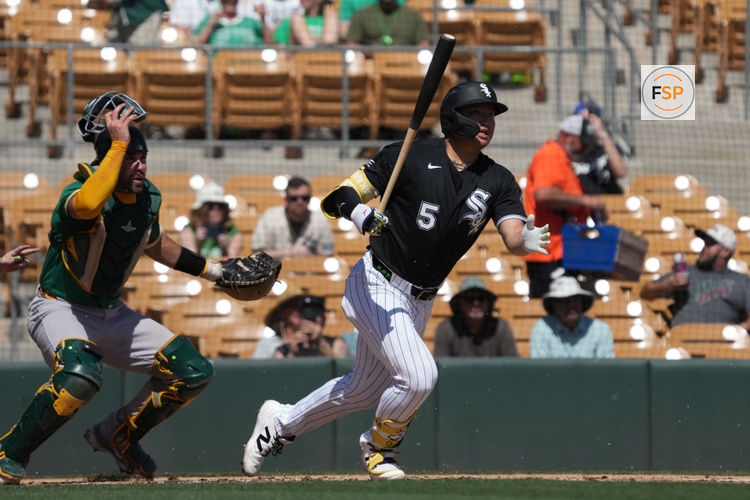 Mar 17, 2026; Phoenix, Arizona, USA; Chicago White Sox third baseman Munetaka Murakami (5) hits against the Athletics in the first inning at Camelback Ranch-Glendale. Credit: Rick Scuteri-Imagn Images