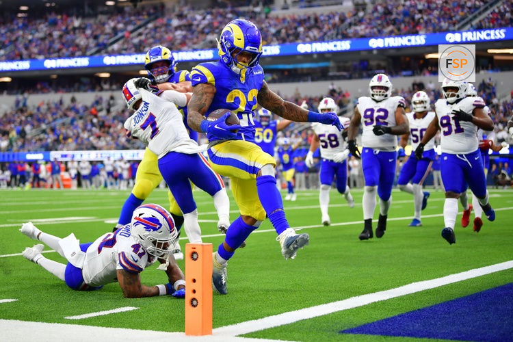 Dec 8, 2024; Inglewood, California, USA; Los Angeles Rams running back Kyren Williams (23) scores a touchdown ahead of Buffalo Bills cornerback Christian Benford (47) during the second half at SoFi Stadium. Credit: Gary A. Vasquez-Imagn Images