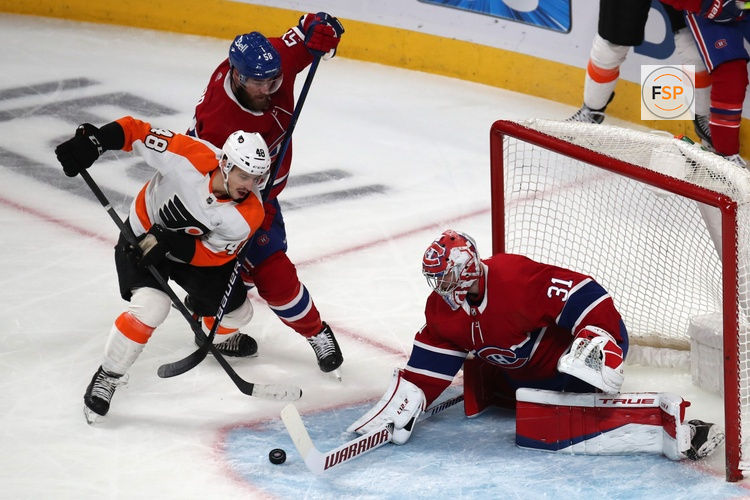Apr 21, 2022; Montreal, Quebec, CAN; Montreal Canadiens goaltender Carey Price (31) makes a save against Philadelphia Flyers center Morgan Frost (48) as defenseman David Savard (58) defends during the third period at Bell Centre. Credit: Jean-Yves Ahern-USA TODAY Sports