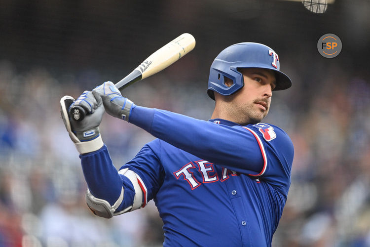 DENVER, CO - MAY 10: Texas Rangers first base Nathaniel Lowe (30) warms up before batting in the first inning during a game between the Texas Rangers and the Colorado Rockies at Coors Field on May 10, 2024 in Denver, Colorado. (Photo by Dustin Bradford/Icon Sportswire)