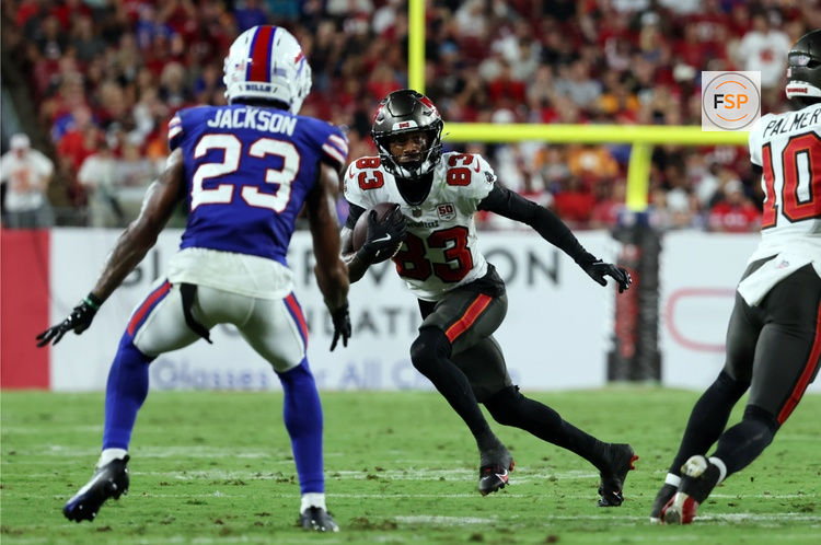 Aug 23, 2025; Tampa, Florida, USA; Tampa Bay Buccaneers wide receiver Tez Johnson (83) runs with the ball as Buffalo Bills cornerback Dane Jackson (23) defends  during the second quarter at Raymond James Stadium. Credit: Kim Klement Neitzel-Imagn Images