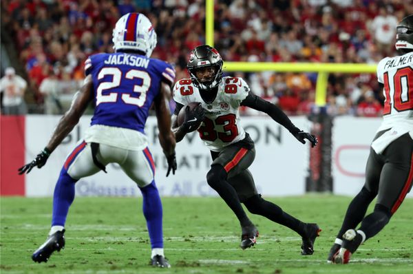 Aug 23, 2025; Tampa, Florida, USA; Tampa Bay Buccaneers wide receiver Tez Johnson (83) runs with the ball as Buffalo Bills cornerback Dane Jackson (23) defends  during the second quarter at Raymond James Stadium. Mandatory Credit: Kim Klement Neitzel-Imagn Images