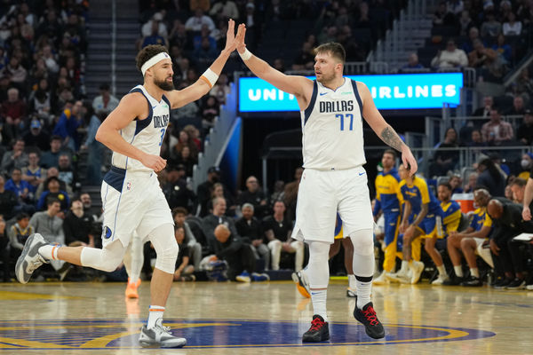 Dec 15, 2024; San Francisco, California, USA; Dallas Mavericks guard Klay Thompson (left) is congratulated by guard Luka Doncic (77) after scoring against the Golden State Warriors during the third quarter at Chase Center. Mandatory Credit: Darren Yamashita-Imagn Images