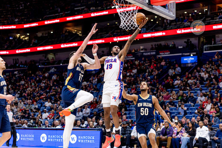 Mar 24, 2025; New Orleans, Louisiana, USA;  Philadelphia 76ers forward Justin Edwards (19) drives to the basket against New Orleans Pelicans center Karlo Matkovic (17) during the first half at Smoothie King Center. Credit: Stephen Lew-Imagn Images