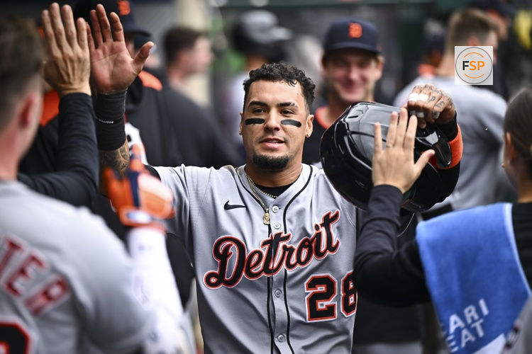 May 4, 2025; Anaheim, California, USA; Detroit Tigers outfielder Javier Baez (28) celebrates with teammates after scoring against the Los Angeles Angels during the sixth inning at Angel Stadium. Credit: Jonathan Hui-Imagn Images