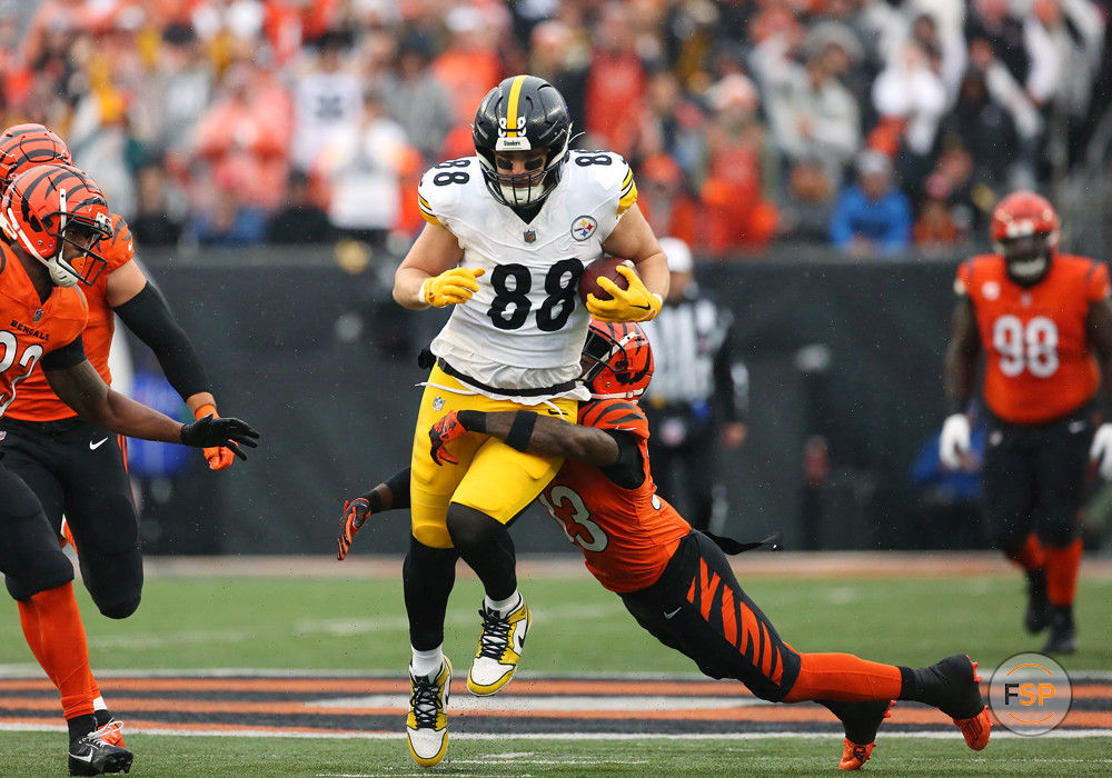CINCINNATI, OH - NOVEMBER 26: Pittsburgh Steelers tight end Pat Freiermuth (88) is tackled by Cincinnati Bengals safety Nick Scott (33) in a game between the Pittsburgh Steelers and the Cincinnati Bengals at Paycor Stadium on Sunday, November. 26, 2023. (Photo by Jeff Moreland/Icon Sportswire)