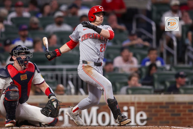 May 8, 2025; Atlanta, Georgia, USA; Cincinnati Reds center fielder TJ Friedl (29) hits an RBI single against the Atlanta Braves in the seventh inning at Truist Park. Credit: Brett Davis-Imagn Images