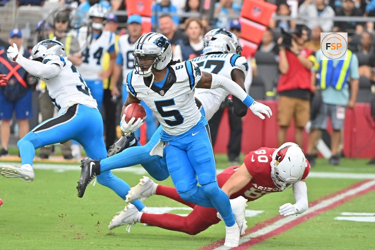 Sep 14, 2025; Glendale, Arizona, USA;  Carolina Panthers running back Rico Dowdle (5) runs the ball during the first quarter against the Arizona Cardinals at State Farm Stadium. Credit: Matt Kartozian-Imagn Images