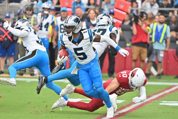 Sep 14, 2025; Glendale, Arizona, USA;  Carolina Panthers running back Rico Dowdle (5) runs the ball during the first quarter against the Arizona Cardinals at State Farm Stadium. Mandatory Credit: Matt Kartozian-Imagn Images