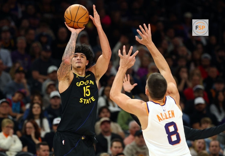 Feb 5, 2026; Phoenix, Arizona, USA; Golden State Warriors forward Gui Santos (15) shoots the ball against the Phoenix Suns in the first half at Mortgage Matchup Center. Credit: Mark J. Rebilas-Imagn Images