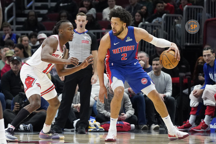 Feb 11, 2025; Chicago, Illinois, USA; Chicago Bulls guard Ayo Dosunmu (11) defends Detroit Pistons guard Cade Cunningham (2) during the first quarter at United Center. Credit: David Banks-Imagn Images