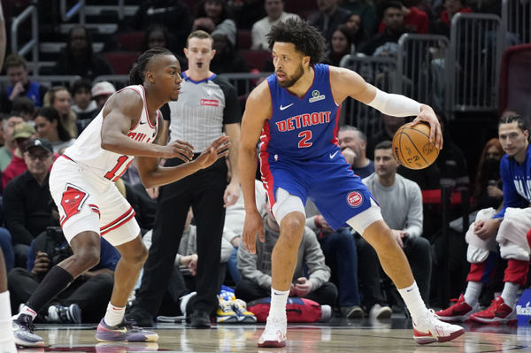 Feb 11, 2025; Chicago, Illinois, USA; Chicago Bulls guard Ayo Dosunmu (11) defends Detroit Pistons guard Cade Cunningham (2) during the first quarter at United Center. Mandatory Credit: David Banks-Imagn Images