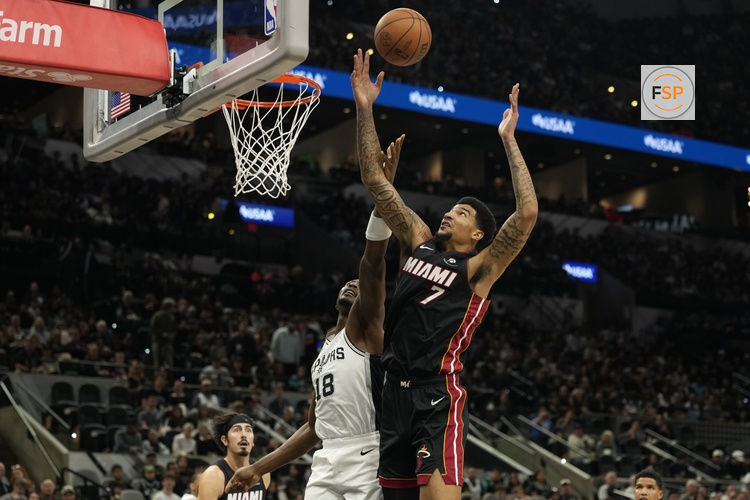 Oct 30, 2025; San Antonio, Texas, USA; Miami Heat center Kel'el Ware (7) and San Antonio Spurs center Bismack Biyombo (18) battle for a rebound during the first half at Frost Bank Center. Credit: Scott Wachter-Imagn Images