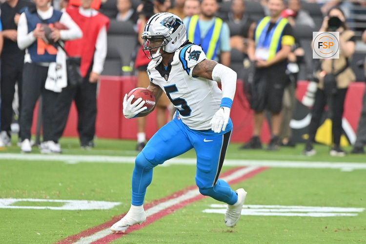 Sep 14, 2025; Glendale, Arizona, USA;  Carolina Panthers running back Rico Dowdle (5) runs the ball during the first quarter against the Arizona Cardinals at State Farm Stadium. Credit: Matt Kartozian-Imagn Images