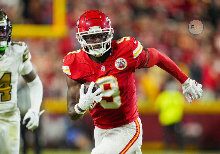 Oct 7, 2024; Kansas City, Missouri, USA; Kansas City Chiefs wide receiver JuJu Smith-Schuster (9) runs with the ball during the first half against the New Orleans Saints at GEHA Field at Arrowhead Stadium. Credit: Jay Biggerstaff-Imagn Images