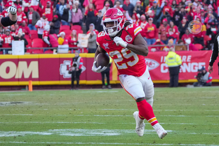 Dec 21, 2024; Kansas City, Missouri, USA; Kansas City Chiefs running back Kareem Hunt (29) runs the ball against the Houston Texans during the second half at GEHA Field at Arrowhead Stadium. Credit: Denny Medley-Imagn Images