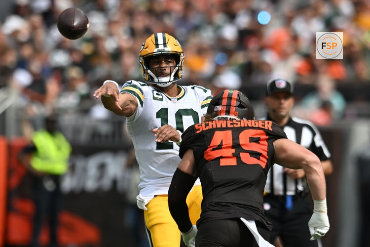 Sep 21, 2025; Cleveland, Ohio, USA; Green Bay Packers quarterback Jordan Love (10) throws a pass as Cleveland Browns linebacker Carson Schwesinger (49) rushes during the second half at Huntington Bank Field. Credit: Ken Blaze-Imagn Images