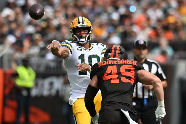 Sep 21, 2025; Cleveland, Ohio, USA; Green Bay Packers quarterback Jordan Love (10) throws a pass as Cleveland Browns linebacker Carson Schwesinger (49) rushes during the second half at Huntington Bank Field. Mandatory Credit: Ken Blaze-Imagn Images