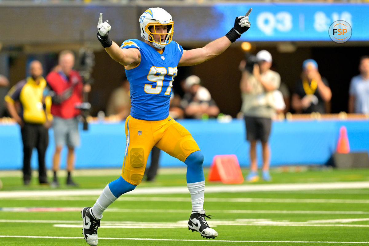 Sep 8, 2024; Inglewood, California, USA;  Los Angeles Chargers linebacker Joey Bosa (97) celebrates after forcing a fumble in the second half against the Las Vegas Raiders at SoFi Stadium. Credit: Jayne Kamin-Oncea-Imagn Images