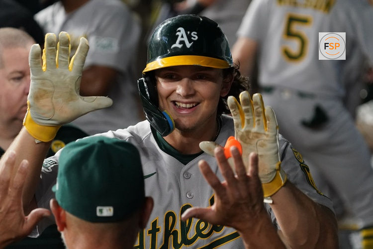July 21, 2025; Arlington, Texas, USA; Athletics first baseman Nick Kurtz (16) is greeted in the dugout after hitting a solo home run during the sixth inning against the Texas Rangers at Globe Life Field. Credit: Raymond Carlin III-Imagn Images