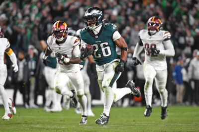 Nov 14, 2024; Philadelphia, Pennsylvania, USA; Philadelphia Eagles running back Saquon Barkley (26) runs past Washington Commanders defenders on way to a 39-yard touchdown during the fourth quarter against the Washington Commanders at Lincoln Financial Field. Mandatory Credit: Eric Hartline-Imagn Images