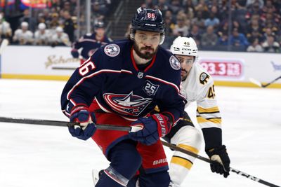 Apr 12, 2026; Columbus, Ohio, USA; Columbus Blue Jackets right wing Kirill Marchenko (86) and Boston Bruins defenseman Jonathan Aspirot (45) skate after a loose puck during the first period at Nationwide Arena. Mandatory Credit: Russell LaBounty-Imagn Images
