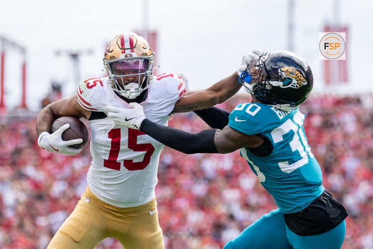 September 28, 2025; Santa Clara, California, USA; San Francisco 49ers wide receiver Jauan Jennings (15) is tackled by Jacksonville Jaguars cornerback Montaric Brown (30) during the second quarter at Levi's Stadium. Credit: Kyle Terada-Imagn Images