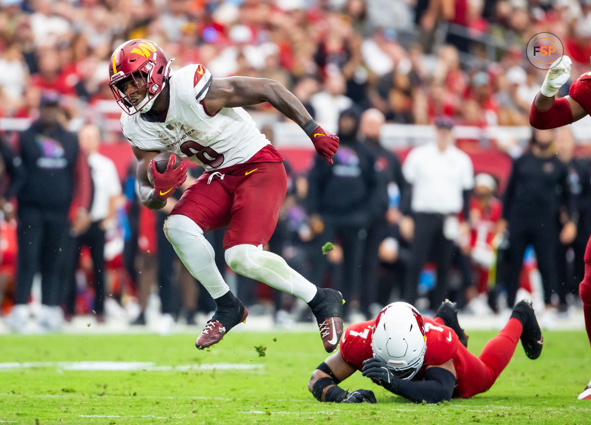 Sep 29, 2024; Glendale, Arizona, USA; Washington Commanders running back Brian Robinson Jr. (8) against the Arizona Cardinals in the second half at State Farm Stadium. Credit: Mark J. Rebilas-Imagn Images