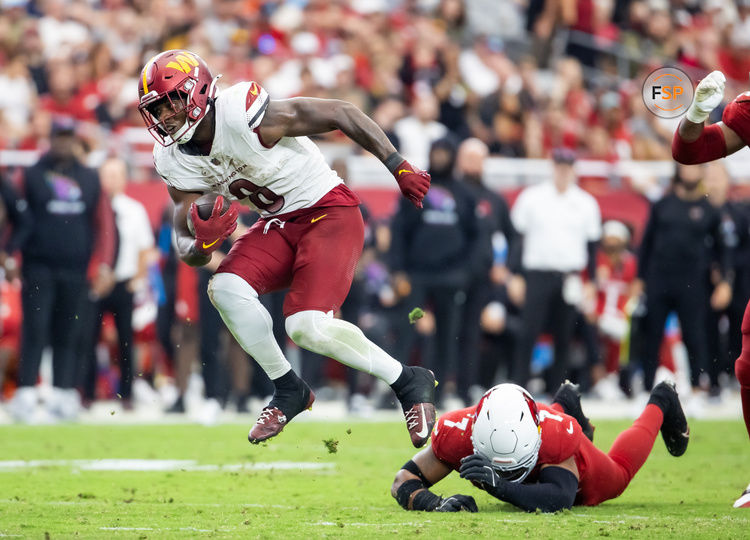 Sep 29, 2024; Glendale, Arizona, USA; Washington Commanders running back Brian Robinson Jr. (8) against the Arizona Cardinals in the second half at State Farm Stadium. Credit: Mark J. Rebilas-Imagn Images