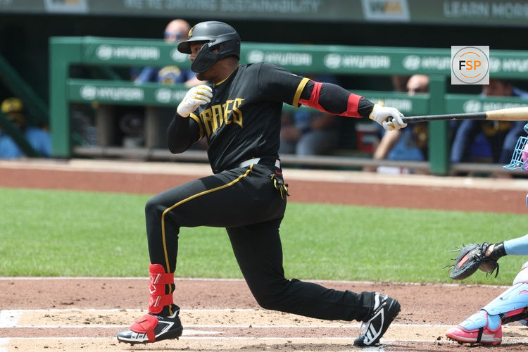 Jul 11, 2026; Pittsburgh, Pennsylvania, USA;  Pittsburgh Pirates right fielder Esmerlyn Valdez (55) hits an RBI single against the Milwaukee Brewers during the first inning at PNC Park. Credit: Charles LeClaire-Imagn Images