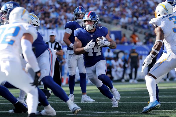 Sep 28, 2025; East Rutherford, New Jersey, USA; New York Giants running back Cam Skattebo (44) runs with the ball against the Los Angeles Chargers during the fourth quarter at MetLife Stadium. Mandatory Credit: Brad Penner-Imagn Images