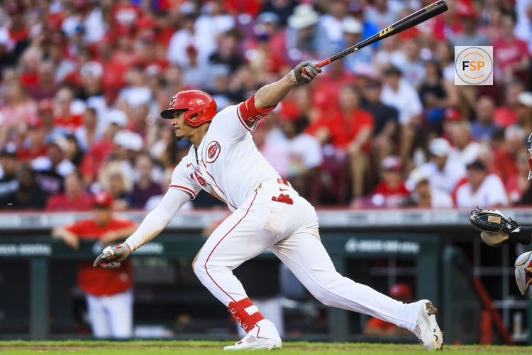 Aug 13, 2025; Cincinnati, Ohio, USA; Cincinnati Reds outfielder Noelvi Marte (16) hits a single in the sixth inning against the Philadelphia Phillies at Great American Ball Park. Cincinnati Reds outfielder Austin Hays (not pictured) and outfielder Noelvi Marte (16) score on a throwing error by Philadelphia Phillies outfielder Brandon Marsh (not pictured) and starting pitcher Cristopher Sanchez (not pictured). Credit: Katie Stratman-Imagn Images