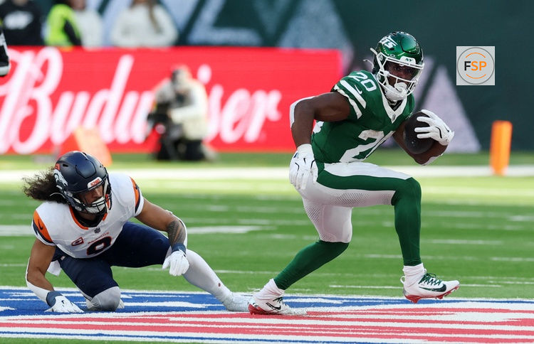 [US, Mexico & Canada customers only] Oct 12, 2025; Tottenham, UNITED KINGDOM; New York Jets running back Breece Hall (20) runs the ball against the Denver Broncos during an NFL International Series game at Tottenham Hotspur Stadium. Credit: Paul Childs/Reuters via Imagn Images