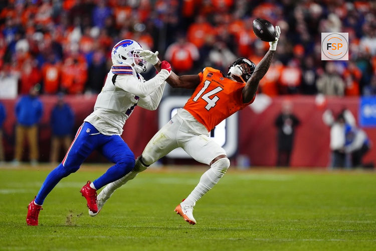 Jan 17, 2026; Denver, CO, USA; Buffalo Bills cornerback Taron Johnson (7) is called for pass interference on Denver Broncos wide receiver Courtland Sutton (14) during overtime of an AFC Divisional Round playoff game at Empower Field at Mile High. Credit: Ron Chenoy-Imagn Images
