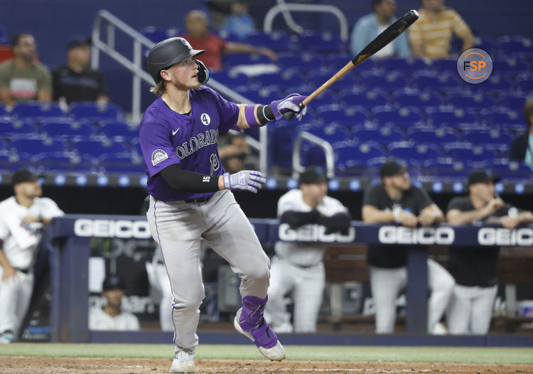 Jun 2, 2025; Miami, Florida, USA;  Colorado Rockies catcher Hunter Goodman (15) watches his home run against the Miami Marlins during the fifth inning at loanDepot Park. Credit: Rhona Wise-Imagn Images
