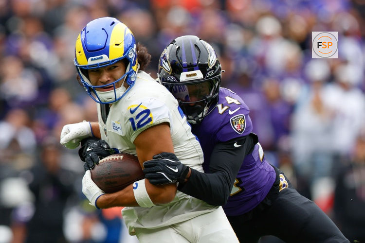 Oct 12, 2025; Baltimore, Maryland, USA; Baltimore Ravens safety Malaki Starks (24) tackles Los Angeles Rams wide receiver Puka Nacua (12) during the second quarter of the game at M&T Bank Stadium. Credit: Peter Casey-Imagn Images
