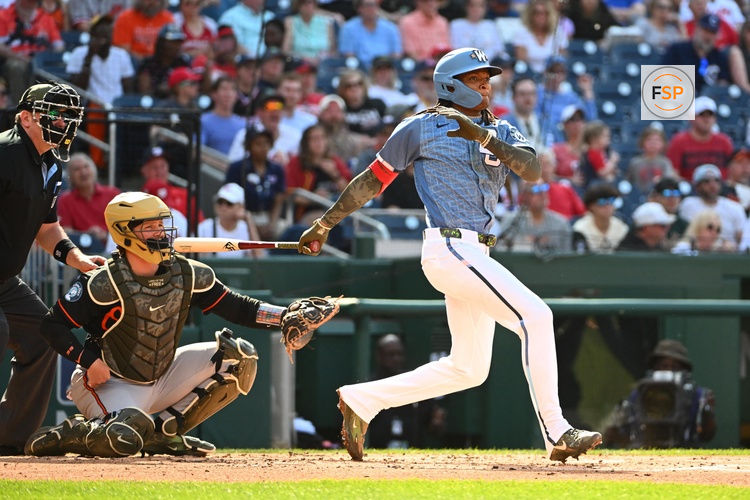 May 16, 2026; Washington, District of Columbia, USA; Washington Nationals shortstop CJ Abrams (5) doubles against the Baltimore Orioles during the second inning at Nationals Park. Credit: Brad Mills-Imagn Images