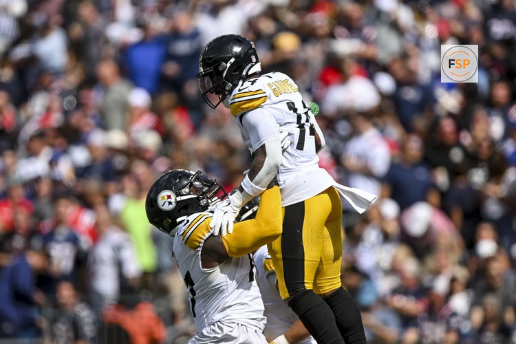 Sep 21, 2025; Foxborough, Massachusetts, USA; Pittsburgh Steelers running back Kenneth Gainwell (14) and Pittsburgh Steelers offensive tackle Broderick Jones (77) react after a touchdown during the first quarter at Gillette Stadium. Credit: Brian Fluharty-Imagn Images
