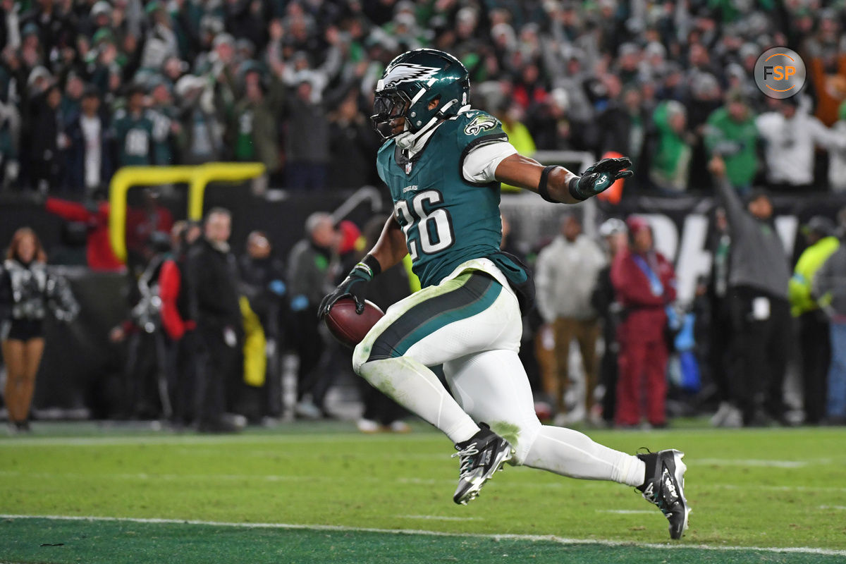 Nov 14, 2024; Philadelphia, Pennsylvania, USA; Philadelphia Eagles running back Saquon Barkley (26) scores on a 39-yard touchdown run during the fourth quarter against the Washington Commanders at Lincoln Financial Field. Credit: Eric Hartline-Imagn Images