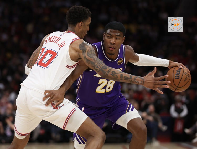 Mar 18, 2026; Houston, Texas, USA;  Los Angeles Lakers forward Rui Hachimura (28) dribbles against Houston Rockets forward Jabari Smith Jr. (10) in the second half at Toyota Center. Credit: Thomas Shea-Imagn Images