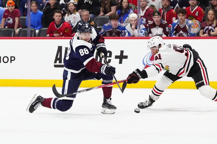 Mar 10, 2025; Denver, Colorado, USA; Chicago Blackhawks center Frank Nazar (91) defends on Colorado Avalanche center Martin Necas (88) in the second period at Ball Arena. Credit: Ron Chenoy-Imagn Images