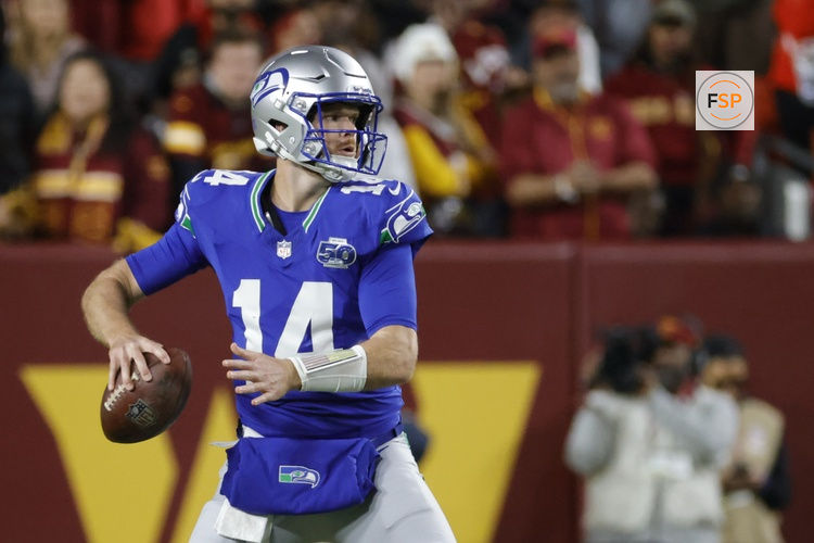 Nov 2, 2025; Landover, Maryland, USA; Seattle Seahawks quarterback Sam Darnold (14) throws the ball against the Washington Commanders during the first half at Northwest Stadium. Credit: Amber Searls-Imagn Images