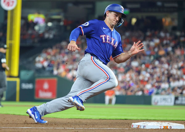 HOUSTON, TX - APRIL 12:  Texas Rangers designated hitter Wyatt Langford (36) rounds third base to score a run during the MLB game between the Texas Rangers and Houston Astros at Minute Maid Park on April 12, 2024 in Houston, Texas.  (Photo by Leslie Plaza Johnson/Icon Sportswire)
