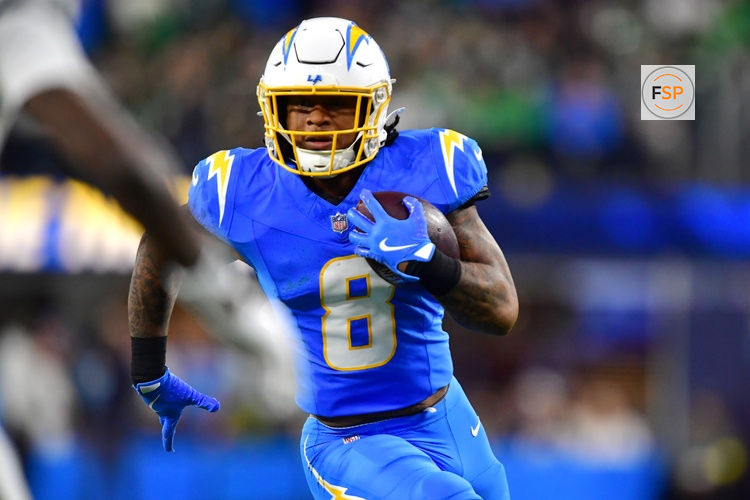 Dec 8, 2025; Inglewood, California, USA; Los Angeles Chargers running back Omarion Hampton (8) runs against the Philadelphia Eagles in the first half at SoFi Stadium. Credit: Gary A. Vasquez-Imagn Images