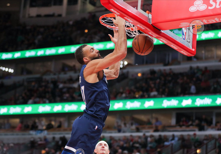 CHICAGO, IL - MARCH 17: Minnesota Timberwolves center Rudy Gobert (27) slam dunks during a NBA game between the Minnesota Timberwolves and the Chicago Bulls on March 17, 2023 at the United Center in Chicago, IL. (Photo by Melissa Tamez/Icon Sportswire)