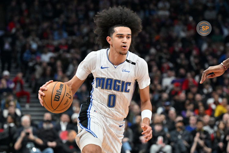 Jan 21, 2025; Toronto, Ontario, CAN; Orlando Magic guard Anthony Black (0) dribbles against the Toronto Raptors in the first half at Scotiabank Arena. Credit: Dan Hamilton-Imagn Images